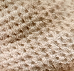 light brown artificial fur soft and worm texture. Faux fur use for background