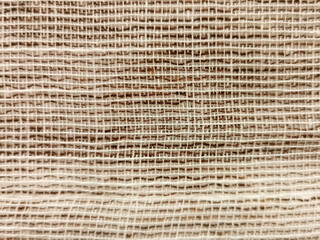 Wicker textile weave threads texture background with selective focus