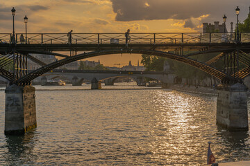 Fototapeta na wymiar Paris, France - 07 17 2020: View of bridge from a boat on the Seine