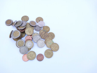 Banknotes and coins on white background