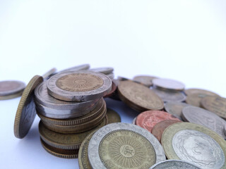 Banknotes and coins on white background