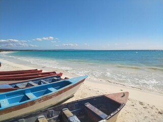 Fototapeta na wymiar Quiet beach in south, DOminican Republic, fishing boats