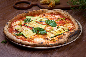 Italian Vegan Pizza zucchini on dark a wooden table. Healthy food