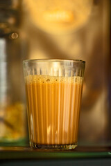 
Milk tea in a glass or Indian Karak chai.