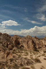 Fototapeta premium Desert landscape. Geology. View of the arid valley, sandstone and rocky formations under a beautiful blue sky.