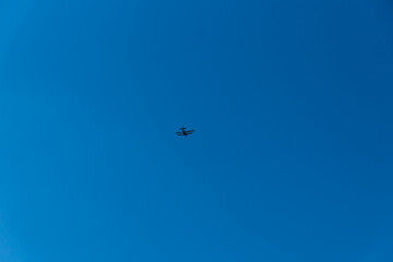 plane with a propeller in the blue sky