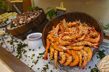 Prawn and shrimps on ice, Seafood buffet line in restaurant