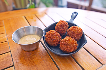 Bitterballen with mayo in bowl 