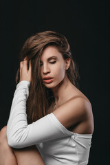 Naklejka premium Close-up portrait of a beautiful caucasian girl with closed eyes. Haircare, Skincare concept