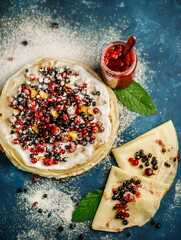 Pancakes with berries. Breakfast. Sweet homemade stack of pancakes