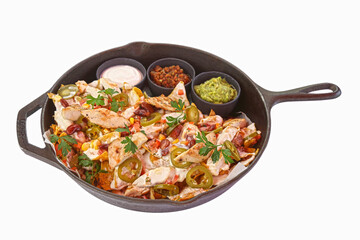 Grilled Chicken nachos with cream sauce served next to guacamole dip