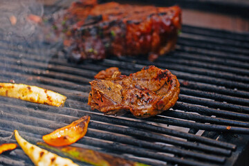 Beef steaks, lamb on the grill with flames and smoke. bbq.