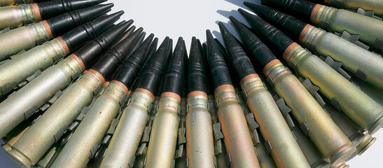 Patrons and ammunition close-up neatly and beautifully laid out, background,