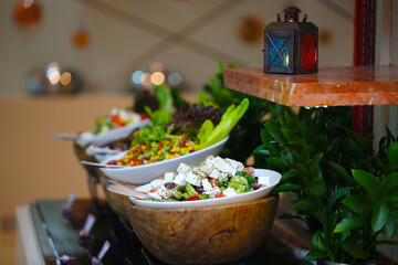 White cheese salad with olives in a buffet 