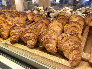 KUALA LUMPUR, MALAYSIA -JULY 17, 2020: Various types of breads are displayed for sale inside the bakery display rack. Made in various designs to provide variations to customers.