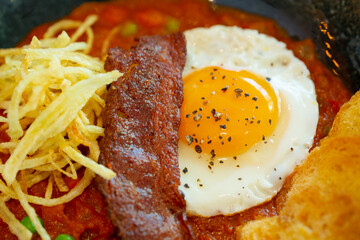 Bacon, egg, bead and green peas as English breakfast.