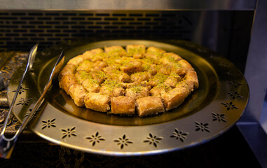 Arabic sweets in a golden plate 