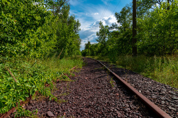Fototapeta premium Ukraine, Krivoy Rog, the 16 of July 2020. Rarely used rail tracks near the town park.