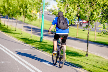 Fototapeta premium Cyclist ride on the bike path in the city Park 