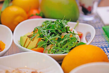 Avocado, egg and cherry tomato salad for healthy breakfast 