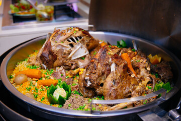 Lamb ouzi in a buffet setup