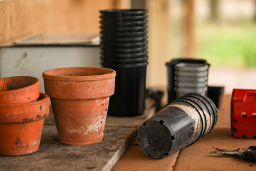Potting bench with empty plant pots in backyard garden