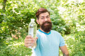 Drink Plenty Of Water. drinking water in forest outdoor with sunset nature on background. Bearded...