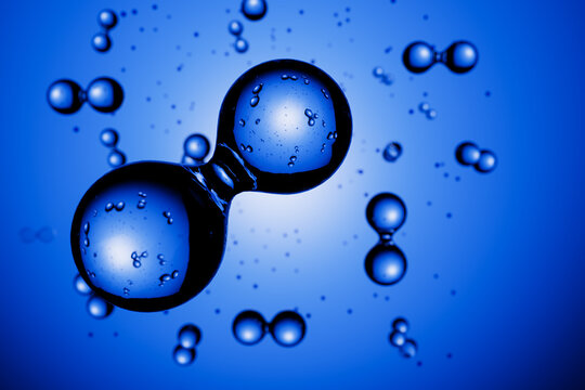 3d render: Abstract hydrogen molecules H2 in front of blue vignetted background