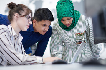 Multiethnic startup business team with Arabian woman