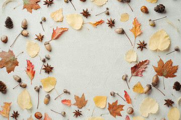 Autumn season abstract background. Fall yellow leaves frame on stone surface. Thanksgiving day, seasonal concept. Copy space.