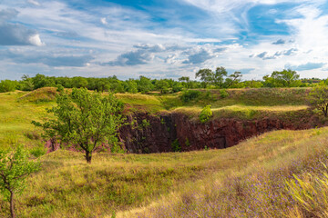 Ukraine, Krivoy Rog, the 16 of July 2020. Earth sinkhole in the abandoned  park outskirts of the city. So called 