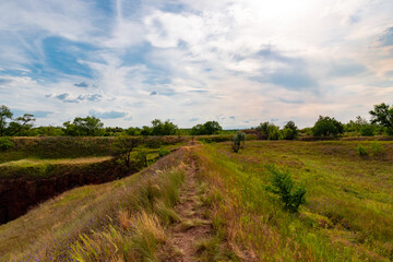 Fototapeta premium Ukraine, Krivoy Rog, the 16 of July 2020. Abandoned city park with beautiful clouds in the sky.