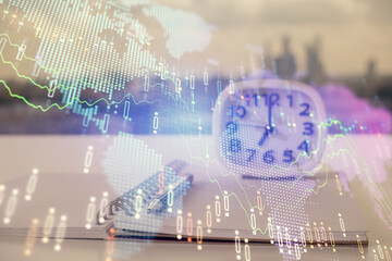 Double exposure of financial graph drawings and desk with open notebook background. Concept of forex market