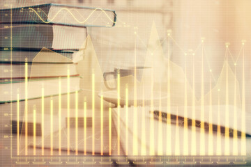 Double exposure of financial chart drawing and desktop with coffee and items on table background. Concept of forex market trading