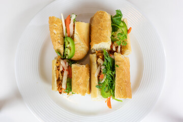 Bahn mi sandwich  on white plate
