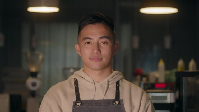 Asian young man remove protective mask at work, covid coronavirus , healthy lifestyle, business owner in new normal post covid, second wave, man barman smiling