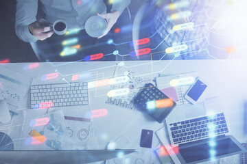 Double exposure of man and woman working together and data theme hologram drawing. Computer background. Top View.