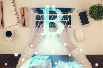 Double exposure of woman hands working on computer and blockchain theme hologram drawing. Top View....