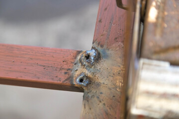 Human working of welding. Lights, manual. welder is welding metal part.