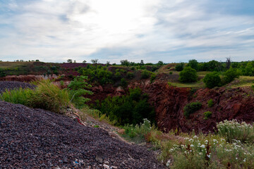 Fototapeta na wymiar Ukraine, Krivoy Rog, the 16 of July 2020. Earth sinkhole in the abandoned park outskirts of the city. So called 