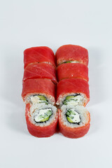 Japanese traditional food. Philadelphia sushi rolls with fresh avocado caviar and cream cheese and smoked salmon