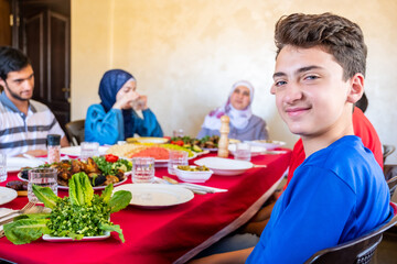 Arabic muslim family eating together in a meeting for iftar in ramadan