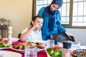 Arabic Muslim family eating together in a meeting for iftar in Ramadan