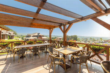 Wooden summer garden restaurant in the beautiful nature