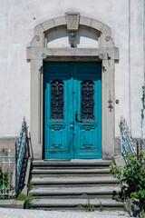 Fototapeta na wymiar old blue wooden door in the old town
