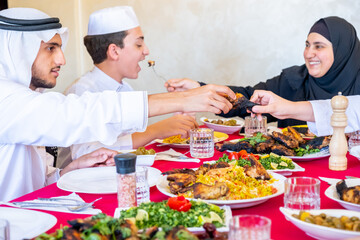 Arabic muslim family eating together in a meeting for iftar in ramdan