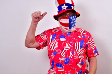 Man with funny uncle sam hat and patriotic shirt is waving with one hand.  .Patriotic man with a...