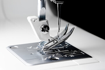 3 - sewing machine close up with a black background