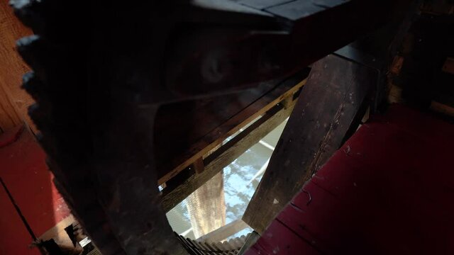 Huge cogwheel of an old watermill staying still.