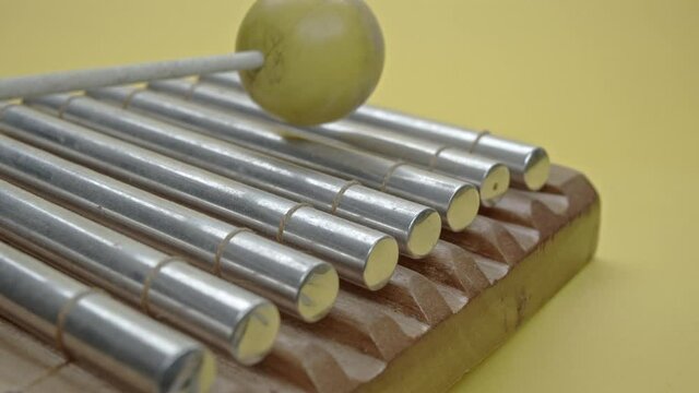 Xylophone with a yellow mallet